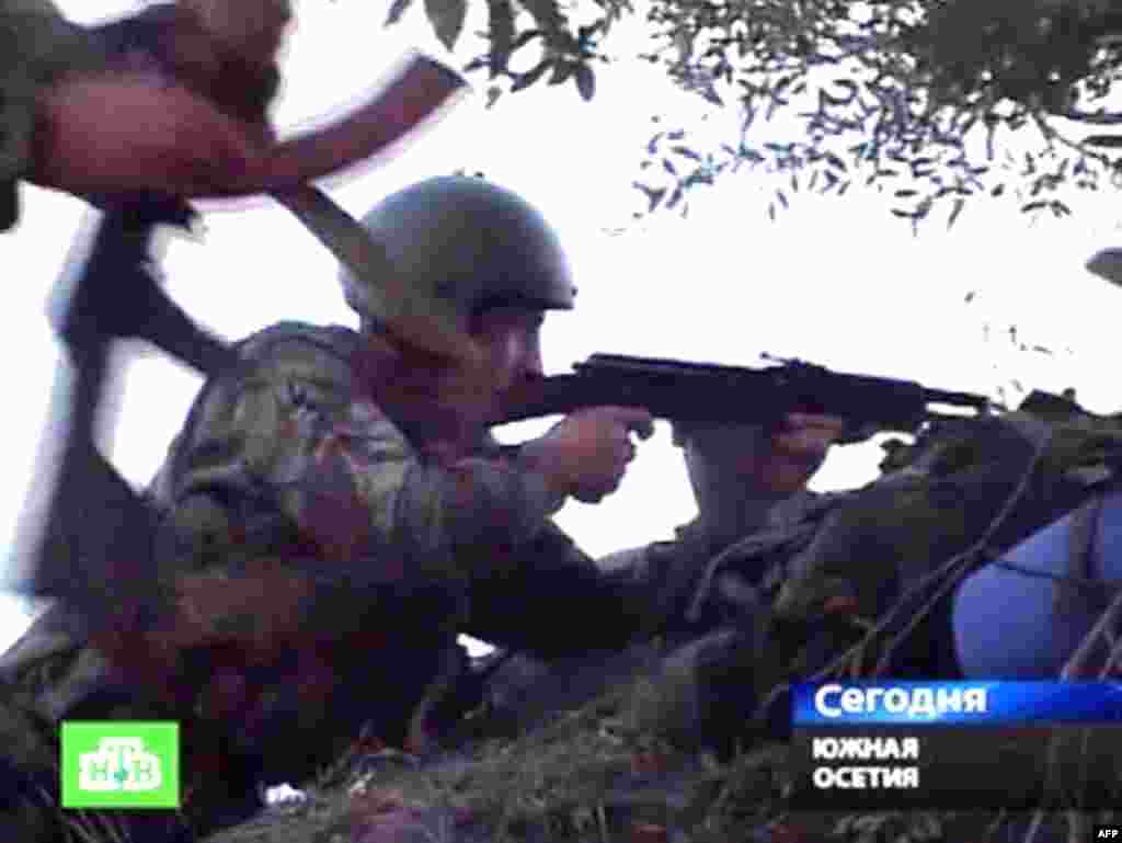 Georgia -- A TV grab shows South Ossetian troops firing at Georgian troops from an unnamed location not far from Tskhinvali, 07Aug2008