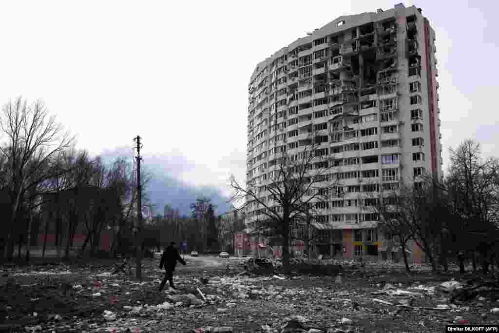 UKRAINE - A man walks in front of a residential building damaged in yesterday&#39;s shelling in the city of Chernihiv on March 4, 2022