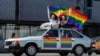 Russia -- Gay-rights activists hold rainbow flags during a protest in central Moscow, 31may2014