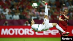 Poland -- Portugal's Cristiano Ronaldo kicks the ball during their Euro 2012 quarter-final soccer match at the National stadium in Warsaw, 21Jun2012