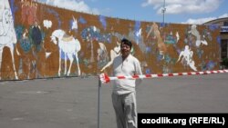 Uzbekistan/Czech Republic - uzbek artist Lekim Ibrohimov near the painting "One thousand angels and one painting" in Prague exhibition area Vystaviste, 09 June 2012