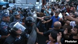 Armenia - Protesters scuffle with riot police near a police station seized by opposition gunmen, Yerevan, 19Jul2016.