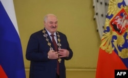 Александр Лукашенко после вручения ему Владимиром Путиным российского ордена св. Андрея Первозванного. Кремль, 9 октября 2024 года