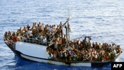 World -- photo released by French authorities of fishing boat carrying around 300 illegal migrants in Mediterranean Sea before 24sep2008