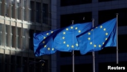 European Union flags fly outside the European Commission headquarters in Brussels, EU, European Commission