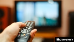 Generic -- Watching TV and using remote controller