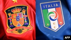 Ukraine -- A combo photo shows shows Spain (L) and Italian jerseys, 29Jun2012